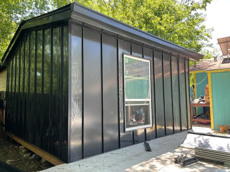 Black standing seam metal wall panels for Roof Inspection in Suffield